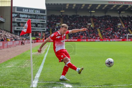 Photo for Herbie Kane of Barnsley takes a corner during the Sky Bet League 1 match Barnsley vs Reading at Oakwell, Barnsley, United Kingdom, 13th April 202 - Royalty Free Image