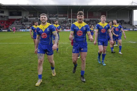 Photo for Max Wood, Jordy Crowther and Matty Nicholson of Warrington Wolves after the Betfred Challenge Cup Quarter Final match St Helens vs Warrington Wolves at Totally Wicked Stadium, St Helens, United Kingdom, 14th April 202 - Royalty Free Image