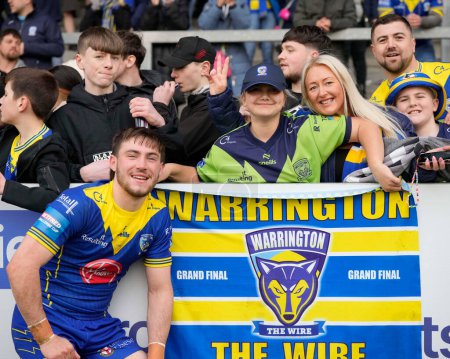 Photo for Adam Holroyd of Warrington Wolves poses for a photo with Wire fans after the Betfred Challenge Cup Quarter Final match St Helens vs Warrington Wolves at Totally Wicked Stadium, St Helens, United Kingdom, 14th April 202 - Royalty Free Image