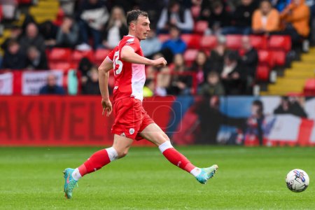 Photo for Josh Earl of Barnsley passes the ball during the Sky Bet League 1 match Barnsley vs Reading at Oakwell, Barnsley, United Kingdom, 13th April 202 - Royalty Free Image