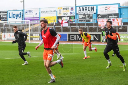 Photo for Blackpool players during the pre-game warm up ahead of the Sky Bet League 1 match Carlisle United vs Blackpool at Brunton Park, Carlisle, United Kingdom, 13th April 202 - Royalty Free Image