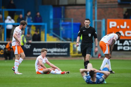 Photo for George Byers of Blackpool goes down injured during the Sky Bet League 1 match Carlisle United vs Blackpool at Brunton Park, Carlisle, United Kingdom, 13th April 202 - Royalty Free Image