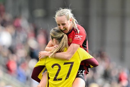 Photo for Millie Turner of Manchester United Women and Mary Earps of Manchester United Women celebrate the full time result, during the Adobe Women's FA Cup Semi-Final match Manchester United Women vs Chelsea FC Women at Leigh Sports Village, Leigh, United Kin - Royalty Free Image