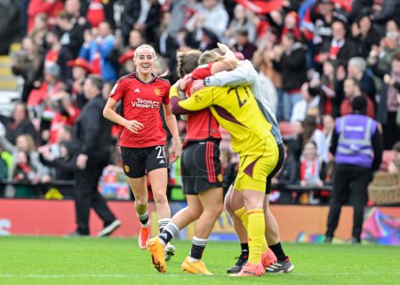 Photo for Millie Turner of Manchester United Women joins Maya Le Tissier of Manchester United Women and Mary Earps of Manchester United Women in celebrating the full time result, during the Adobe Women's FA Cup Semi-Final match Manchester United Women vs Chels - Royalty Free Image