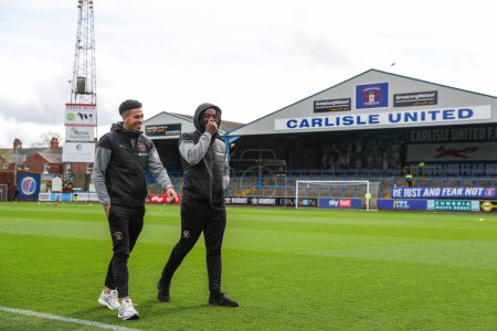 Photo for Jordan Lawrence-Gabriel of Blackpool and Kylian Kouassi of Blackpool arrive ahead of the Sky Bet League 1 match Carlisle United vs Blackpool at Brunton Park, Carlisle, United Kingdom, 13th April 202 - Royalty Free Image