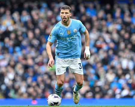 Photo for Rben Dias of Manchester City breaks forward, during the Premier League match Manchester City vs Luton Town at Etihad Stadium, Manchester, United Kingdom, 13th April 2024 - Royalty Free Image