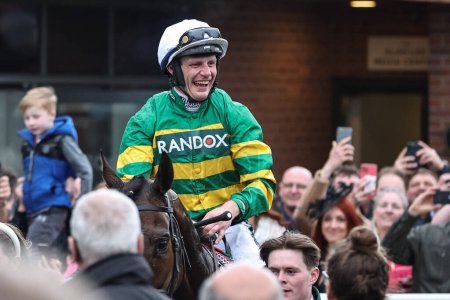 Photo for Paul Townend full of smiles, heads into the winners enclosure after winning the 16:00 Randox Grand National Handicap Chase on I Am Maximus during the Randox Grand National Day 2024 at Aintree Racecourse, Liverpool, United Kingdom, 13th April 202 - Royalty Free Image