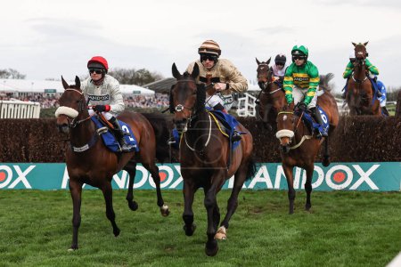 Photo for Chianti Classico ridden by David Bass and Broadway Boy ridden by Sam Twiston-Davies  lead the field during the 1:45pm Huyton Asphalt Franny Blennerhassett Memorial Mildmay Novices Steeple Chase (Class 1) during the The Randox Grand National 2024 - Royalty Free Image