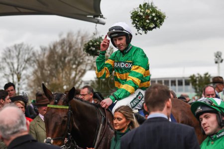 Photo for Inothewayurthinkin ridden by Mark Walsh celebrates winning the 1:45pm Huyton Asphalt Franny Blennerhassett Memorial Mildmay Novices Steeple Chase (Class 1) during the The Randox Grand National 2024 Ladies Day at Aintree Racecourse, Liverpool, UK - Royalty Free Image