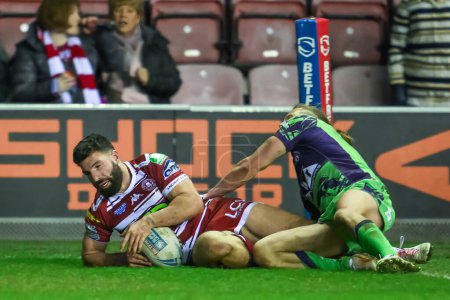 Photo for Abbas Miski of Wigan Warriors scores a try during the Betfred Super League Round 8 match Wigan Warriors vs Castleford Tigers at DW Stadium, Wigan, United Kingdom, 19th April 202 - Royalty Free Image