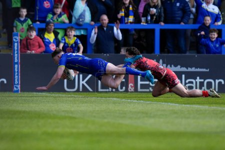 Photo for Matty Nicholson of Warrington Wolves dives over the line to score a try during the Betfred Super League Round 8 match Warrington Wolves vs Leigh Leopards at Halliwell Jones Stadium, Warrington, United Kingdom, 20th April 202 - Royalty Free Image