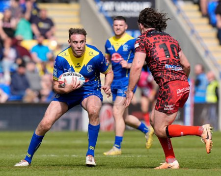 Photo for James Harrison of Warrington Wolves cuts back on Robbie Mulhern of Leigh Leopards during the Betfred Super League Round 8 match Warrington Wolves vs Leigh Leopards at Halliwell Jones Stadium, Warrington, United Kingdom, 20th April 202 - Royalty Free Image