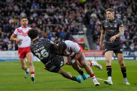 Photo for Konrad Hurrell of St. Helens puts in a big hit on Lewis Martin of Hull FC during the Betfred Super League  Round 8 match St Helens vs Hull FC at Totally Wicked Stadium, St Helens, United Kingdom, 19th April 202 - Royalty Free Image