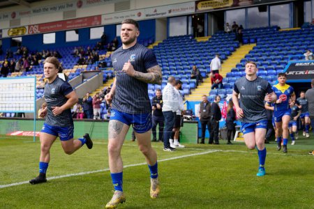 Photo for Connor Wrench of Warrington Wolves runs out for the warm up before the Betfred Super League Round 8 match Warrington Wolves vs Leigh Leopards at Halliwell Jones Stadium, Warrington, United Kingdom, 20th April 202 - Royalty Free Image