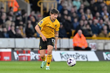 Photo for Hugo Bueno of Wolverhampton Wanderers in action, during the Premier League match Wolverhampton Wanderers vs Arsenal at Molineux, Wolverhampton, United Kingdom, 20th April 202 - Royalty Free Image