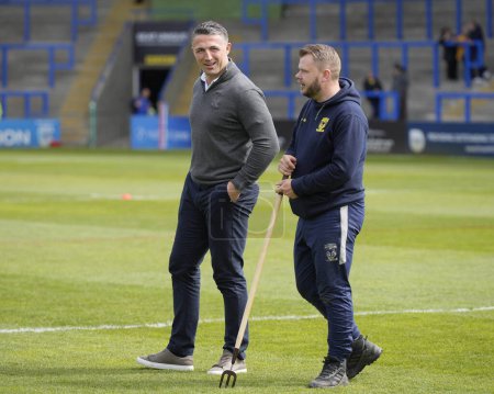 Photo for Sam Burgess, Coach of Warrington Wolves speaks with the Wolves groundsman before the Betfred Super League Round 8 match Warrington Wolves vs Leigh Leopards at Halliwell Jones Stadium, Warrington, United Kingdom, 20th April 202 - Royalty Free Image