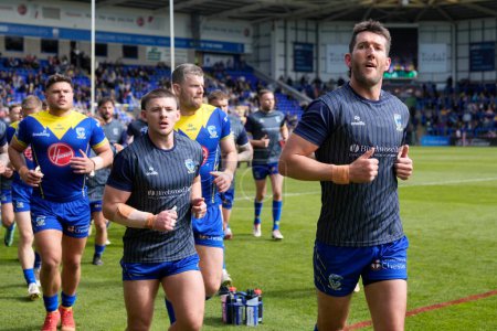 Photo for Stefan Ratchford of Warrington Wolves leads the team off the pitch after the warm up before  the Betfred Super League Round 8 match Warrington Wolves vs Leigh Leopards at Halliwell Jones Stadium, Warrington, United Kingdom, 20th April 202 - Royalty Free Image