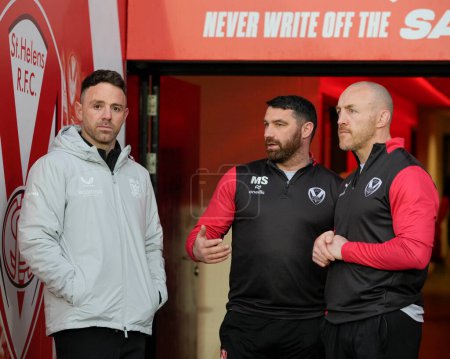 Photo for Richie Myler, Director of Rugby at Hull FC speaks with Matty Smith and James Roby, coaches of St Helens before the Betfred Super League  Round 8 match St Helens vs Hull FC at Totally Wicked Stadium, St Helens, United Kingdom, 19th April 202 - Royalty Free Image