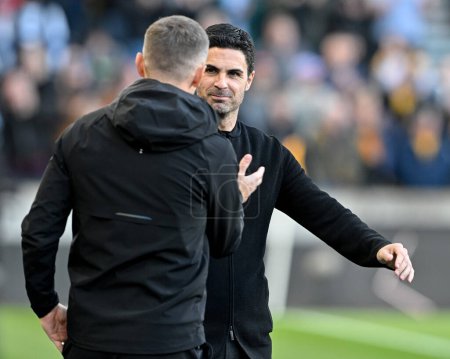 Photo for Two managers Mikel Arteta manager of Arsenal and Gary O'Neil manager of Wolverhampton Wanderers shake hands ahead of kick off, during the Premier League match Wolverhampton Wanderers vs Arsenal at Molineux, Wolverhampton, United Kingdom, 20th April 2 - Royalty Free Image