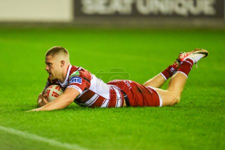 Photo for Ryan Hampshire of Wigan Warriors scores a try during the Betfred Super League Round 8 match Wigan Warriors vs Castleford Tigers at DW Stadium, Wigan, United Kingdom, 19th April 202 - Royalty Free Image