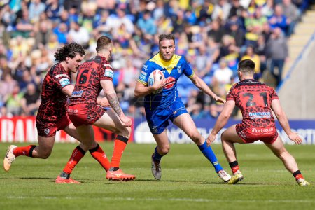 Photo for James Harrison of Warrington Wolves runs at the Leigh Leopards defence during the Betfred Super League Round 8 match Warrington Wolves vs Leigh Leopards at Halliwell Jones Stadium, Warrington, United Kingdom, 20th April 202 - Royalty Free Image