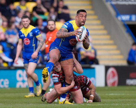 Photo for Paul Vaughan of Warrington Wolves is held by Lachlan Lam of Leigh Leopards during the Betfred Super League Round 8 match Warrington Wolves vs Leigh Leopards at Halliwell Jones Stadium, Warrington, United Kingdom, 20th April 202 - Royalty Free Image
