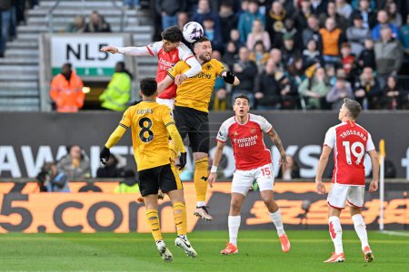 Photo for Matt Doherty of Wolverhampton Wanderers and Kai Havertz of Arsenal battle for the ball, during the Premier League match Wolverhampton Wanderers vs Arsenal at Molineux, Wolverhampton, United Kingdom, 20th April 202 - Royalty Free Image