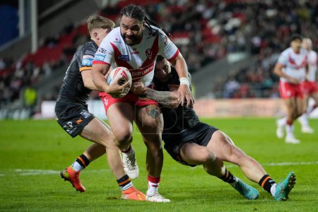 Photo for Konrad Hurrell of St. Helens runs at the Hull FC defence during the Betfred Super League  Round 8 match St Helens vs Hull FC at Totally Wicked Stadium, St Helens, United Kingdom, 19th April 202 - Royalty Free Image