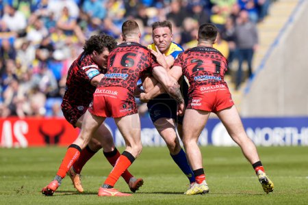 Photo for James Harrison of Warrington Wolves runs at the Leigh Leopards defence during the Betfred Super League Round 8 match Warrington Wolves vs Leigh Leopards at Halliwell Jones Stadium, Warrington, United Kingdom, 20th April 202 - Royalty Free Image