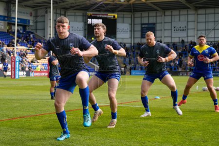 Photo for Matty Nicholson, Adam Holroyd and Joe Bullock of Warrington Wolves warm up before the Betfred Super League Round 8 match Warrington Wolves vs Leigh Leopards at Halliwell Jones Stadium, Warrington, United Kingdom, 20th April 202 - Royalty Free Image