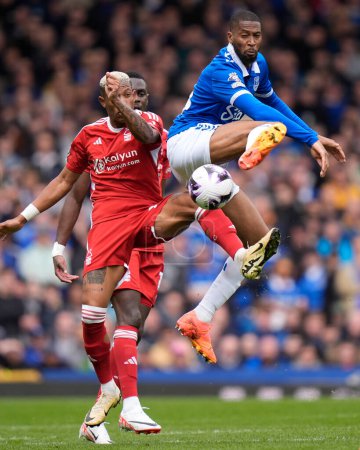 Photo for Danilo of Nottingham Forest competes for the ball with Beto of Everton during the Premier League match Everton vs Nottingham Forest at Goodison Park, Liverpool, United Kingdom, 21st April 202 - Royalty Free Image