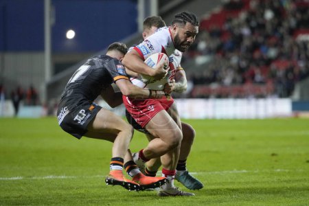 Photo for Konrad Hurrell of St. Helens runs at the Hull FC defence during the Betfred Super League  Round 8 match St Helens vs Hull FC at Totally Wicked Stadium, St Helens, United Kingdom, 19th April 202 - Royalty Free Image