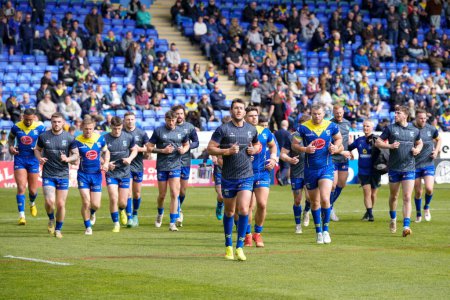 Photo for Stefan Ratchford of Warrington Wolves leads the team off the pitch after the warm up before  the Betfred Super League Round 8 match Warrington Wolves vs Leigh Leopards at Halliwell Jones Stadium, Warrington, United Kingdom, 20th April 202 - Royalty Free Image