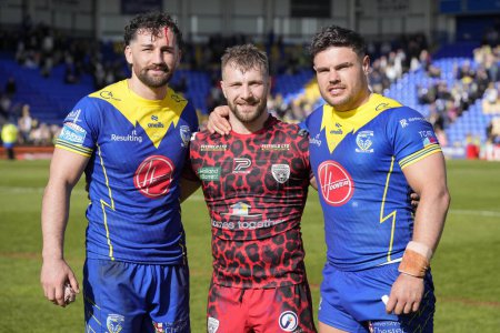 Photo for Toby King of Warrington Wolves, Matty Davis of Leigh Leopards and Joe Philbin of Warrington Wolves pose for a photo after the Betfred Super League Round 8 match Warrington Wolves vs Leigh Leopards at Halliwell Jones Stadium, Warrington, United Kingdo - Royalty Free Image