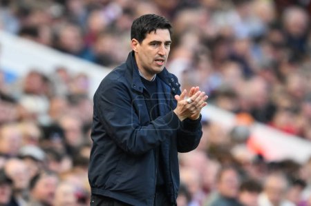Photo for Andoni Iraola Manager of Bournemouth applauds his side during the Premier League match Aston Villa vs Bournemouth at Villa Park, Birmingham, United Kingdom, 21st April 202 - Royalty Free Image