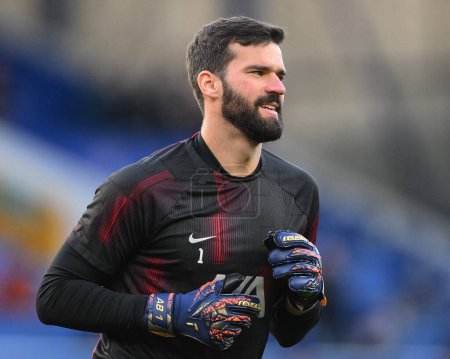 Photo for Alisson Becker of Liverpool wearing Reusch AB1 goalkeeper gloves in the pregame warmup session during the Premier League match Everton vs Liverpool at Goodison Park, Liverpool, United Kingdom, 24th April 202 - Royalty Free Image
