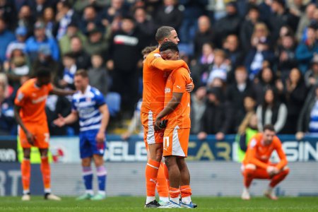 Photo for Oliver Norburn of Blackpool embraces Karamoko Dembele of Blackpool after their loss in the Sky Bet League 1 match Reading vs Blackpool at Select Car Leasing Stadium, Reading, United Kingdom, 27th April 202 - Royalty Free Image