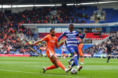 Photo for CJ Hamilton of Blackpool crosses the ball during the Sky Bet League 1 match Reading vs Blackpool at Select Car Leasing Stadium, Reading, United Kingdom, 27th April 202 - Royalty Free Image