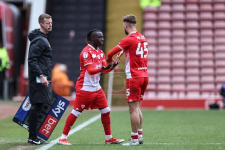 Photo for John Mcatee of Barnsley is substituted for Fbio Jal of Barnsley during the Sky Bet League 1 match Barnsley vs Northampton Town at Oakwell, Barnsley, United Kingdom, 27th April 2024 - Royalty Free Image