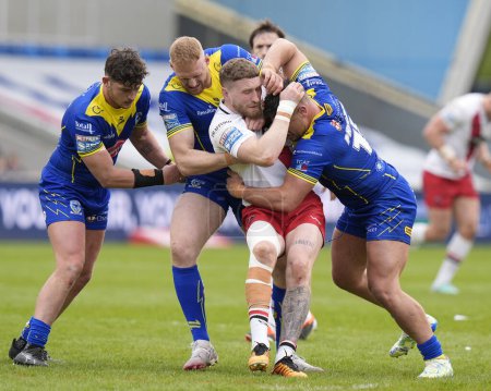 Photo for Joe Bullock of Warrington Wolves and Joe Philbin of Warrington Wolves combine to tackle Ethan Ryan of Salford Red Devils during the Betfred Super League Round 9 match Salford Red Devils vs Warrington Wolves at Salford Community Stadium, Eccles, Unite - Royalty Free Image