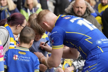Photo for Joe Bullock of Warrington Wolves signs an autograph for a fan after the Betfred Super League Round 9 match Salford Red Devils vs Warrington Wolves at Salford Community Stadium, Eccles, United Kingdom, 27th April 202 - Royalty Free Image