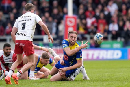 Photo for James Harrison of Warrington Wolves offloads the ball during the Betfred Super League Round 9 match Salford Red Devils vs Warrington Wolves at Salford Community Stadium, Eccles, United Kingdom, 27th April 202 - Royalty Free Image