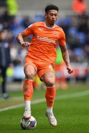 Photo for Jordan Lawrence-Gabriel of Blackpool controls the ball during the Sky Bet League 1 match Reading vs Blackpool at Select Car Leasing Stadium, Reading, United Kingdom, 27th April 202 - Royalty Free Image