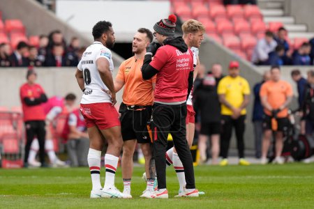 Photo for King Vuniyayawa of Salford Red Devils is assessed by the doctors after a head knock in a tackle on Matty Russell of Warrington Wolves during the Betfred Super League Round 9 match Salford Red Devils vs Warrington Wolves at Salford Community Stadium, - Royalty Free Image