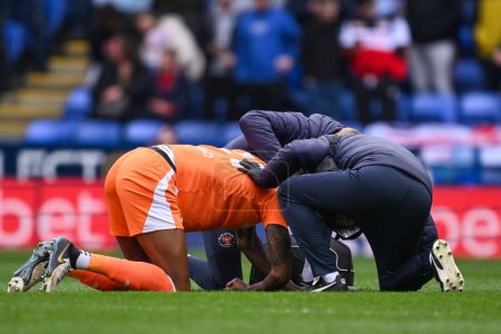 Photo for Marvin Ekpiteta of Blackpool goes down with an injuryv during the Sky Bet League 1 match Reading vs Blackpool at Select Car Leasing Stadium, Reading, United Kingdom, 27th April 202 - Royalty Free Image