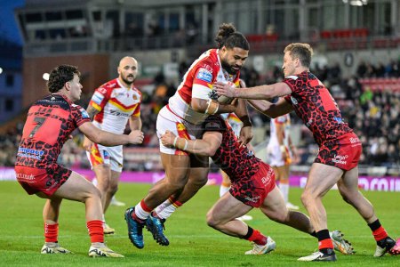Photo for Chris Satae of Catalan Dragons gets tackled, during the Betfred Super League Round 9 match Leigh Leopards vs Catalans Dragons at Leigh Sports Village, Leigh, United Kingdom, 26th April 202 - Royalty Free Image