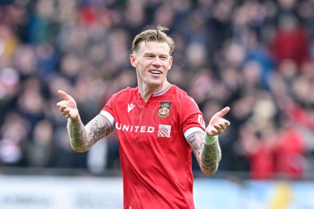 Photo for James McClean of Wrexham celebrates the full time result, during the Sky Bet League 2 match Wrexham vs Stockport County at SToK Cae Ras, Wrexham, United Kingdom, 27th April 202 - Royalty Free Image