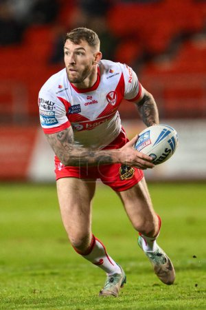 Photo for Daryl Clark of St. Helens makes a break during the Betfred Super League Round 9 match St Helens vs Huddersfield Giants at Totally Wicked Stadium, St Helens, United Kingdom, 25th April 202 - Royalty Free Image