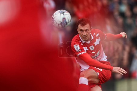 Photo for Josh Earl of Barnsley clears the ball up field during the Sky Bet League 1 match Barnsley vs Northampton Town at Oakwell, Barnsley, United Kingdom, 27th April 202 - Royalty Free Image