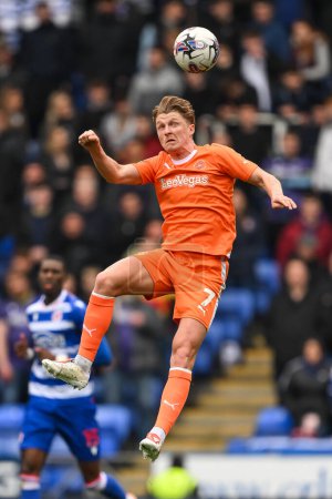 Photo for George Byers of Blackpool jumps up to win the high ball during the Sky Bet League 1 match Reading vs Blackpool at Select Car Leasing Stadium, Reading, United Kingdom, 27th April 202 - Royalty Free Image